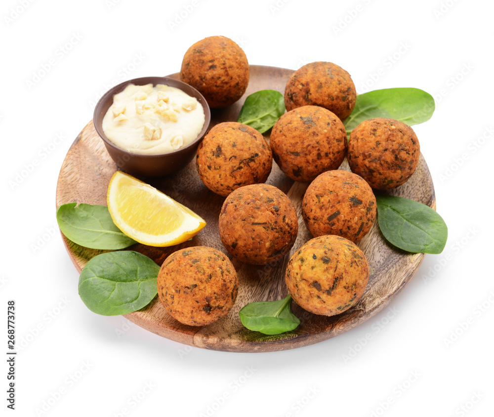 Plate with tasty falafel balls and sauce on white background