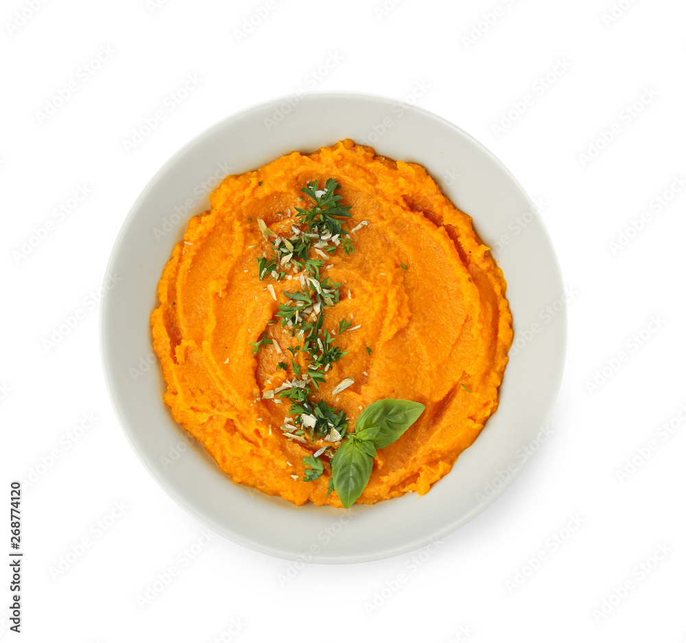 Bowl with mashed sweet potato on white background