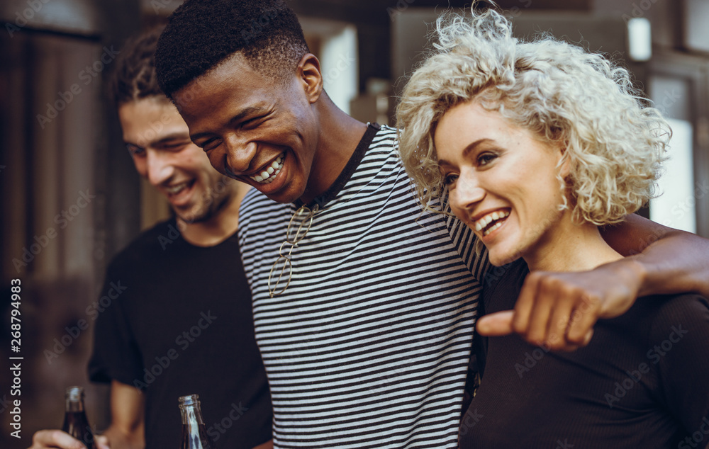 Cheerful young friends hangout out in the city