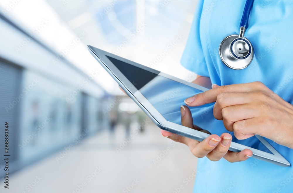 Close-up Doctor at hospital working with tablet pc