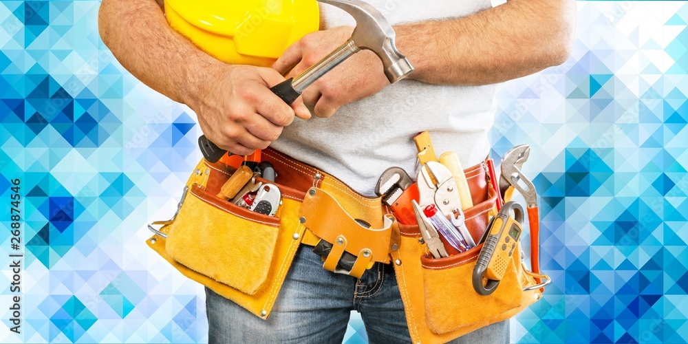 Worker with a tool belt. Isolated over