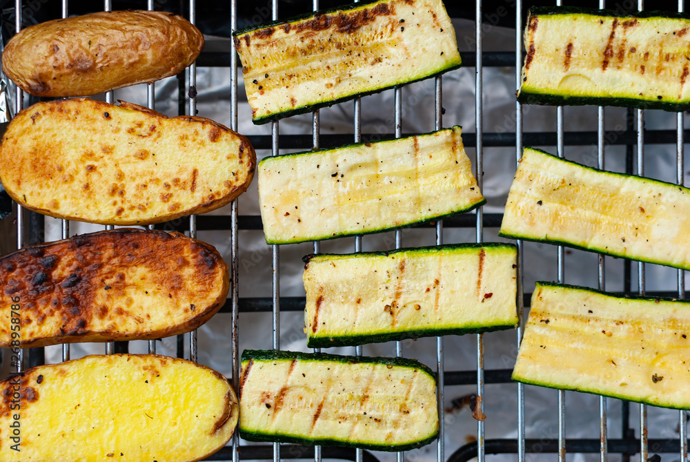 Grilled vegetables on the roast - potatoes and zucchini - vegan