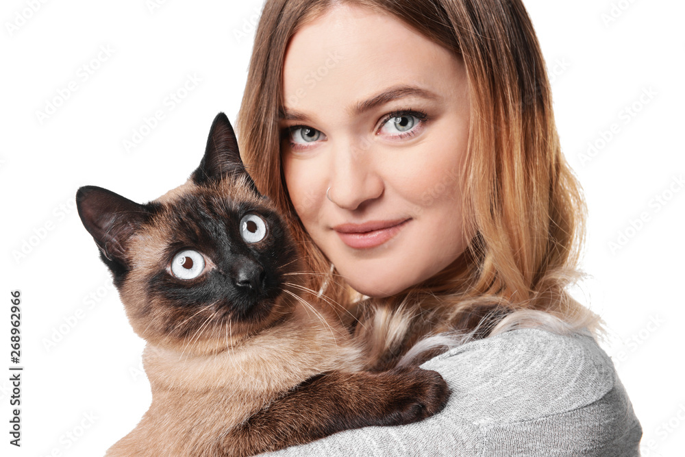 Young woman with cute Thai cat on white background