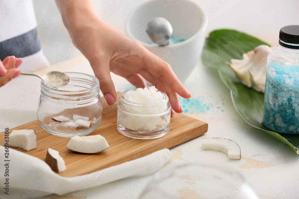 Woman preparing body scrub at table