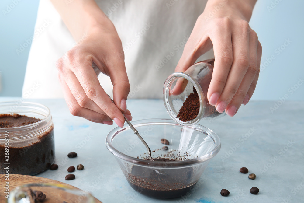 Woman preparing body scrub at table