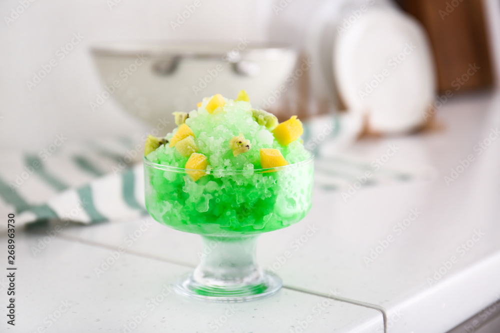 Bowl with tasty shaved ice on light table