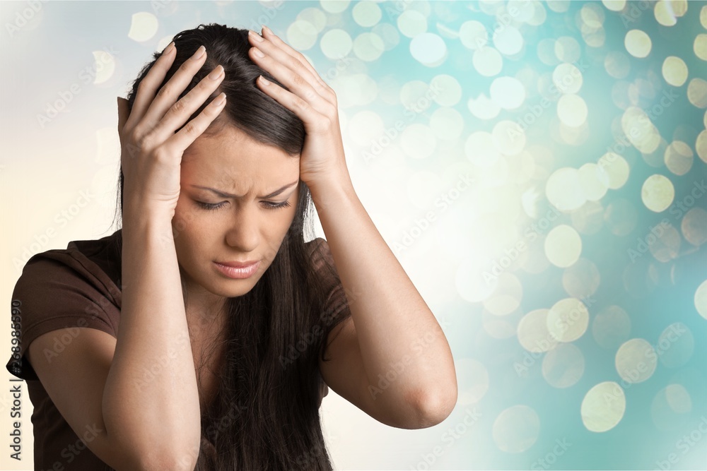 Portrait of a Young Woman Having Headache / Crying