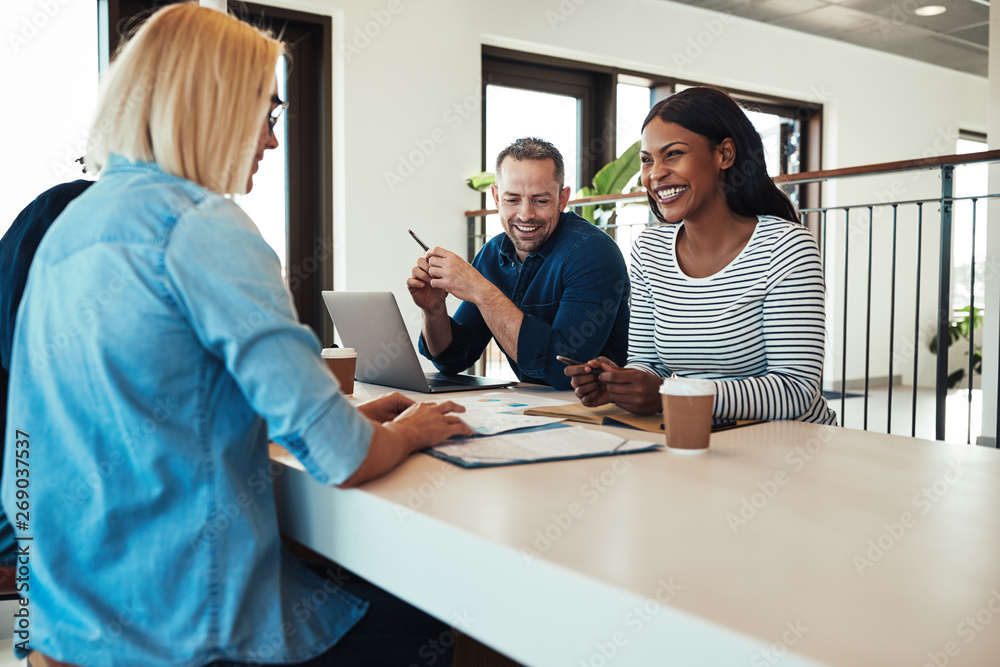 Young African American businesswoman laughing during a meeting