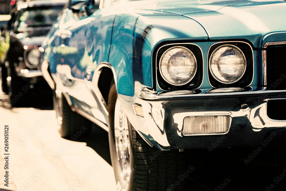 Classic American car headlights close-up, old vintage vehicle show