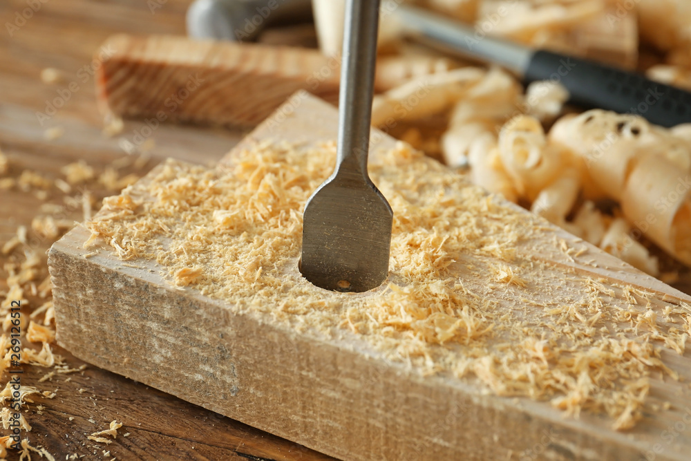 Drilling of wooden plank, closeup