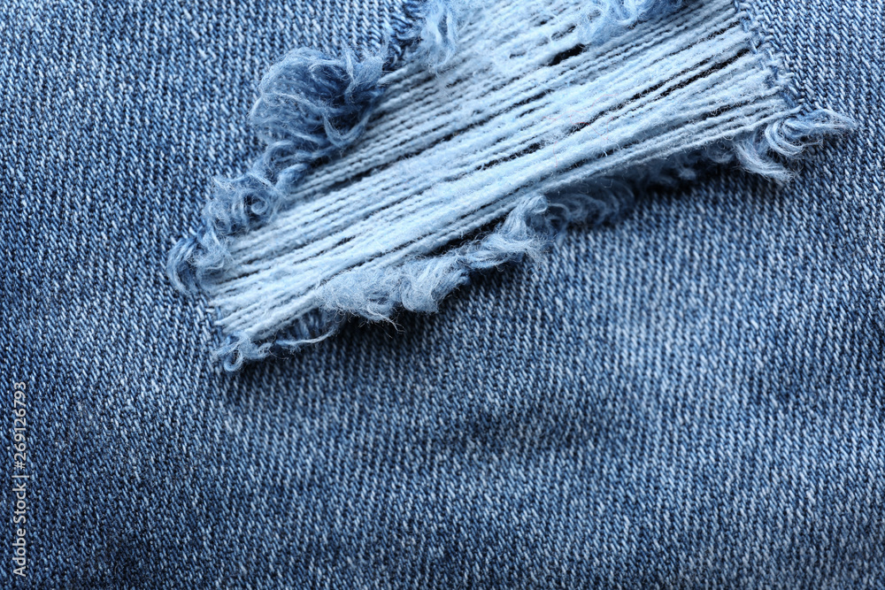 Stylish ripped jeans, closeup view