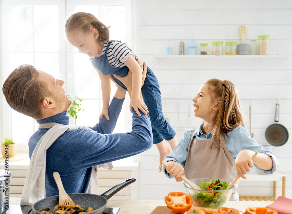 Happy family in the kitchen.