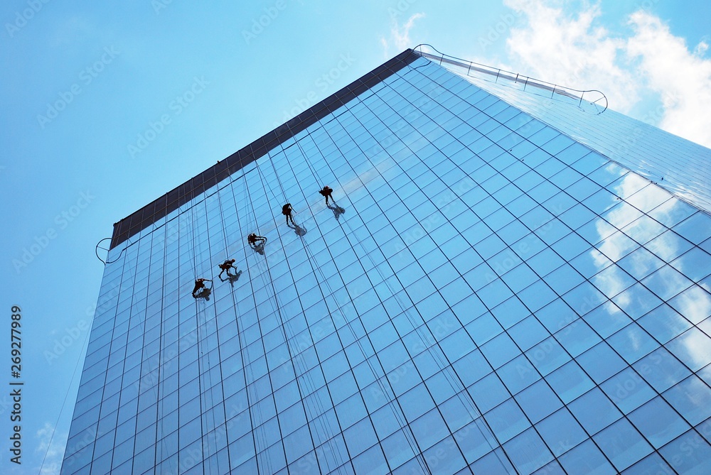 modern office building with blue sky and clouds