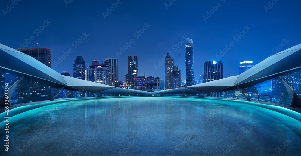 Panoramic view of futuristic geometric shapes design empty floor with Bangkok city skyline . Night s