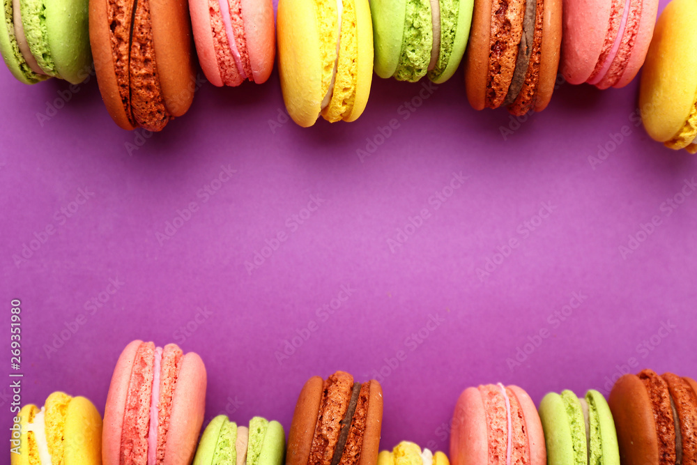 Tasty macarons on color background