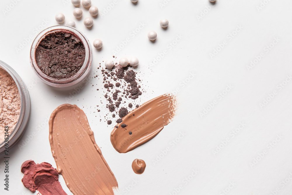 Different cosmetic products on light background