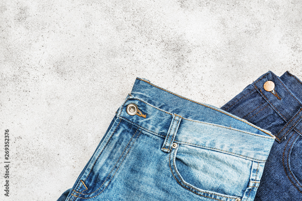 Stylish jeans on light background