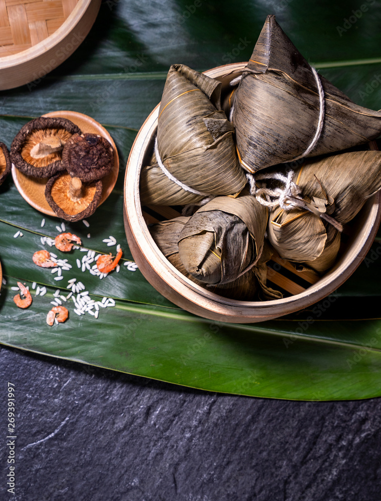 Zongzi, delicious fresh hot steamed rice dumplings in steamer. Close up, copy space, famous asian ta