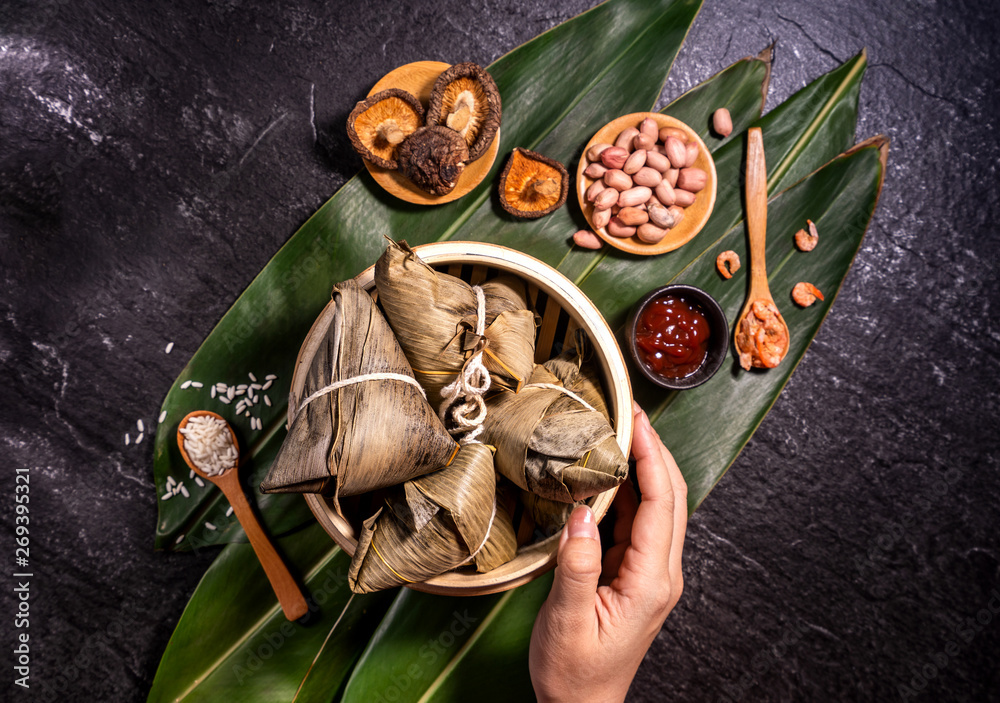 Zongzi, delicious fresh hot steamed rice dumplings in steamer. Close up, copy space, famous asian ta