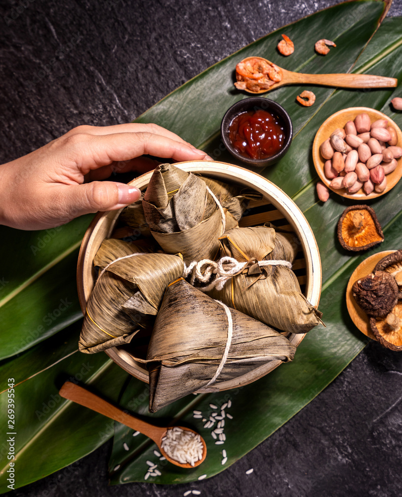 Zongzi, delicious fresh hot steamed rice dumplings in steamer. Close up, copy space, famous asian ta