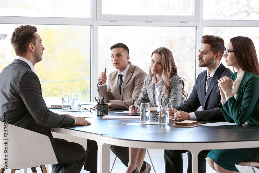 Human resources commission interviewing man in office