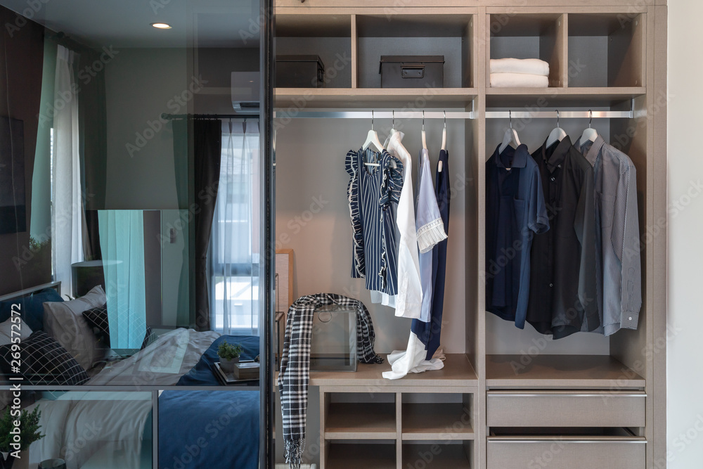 modern closet with clothes