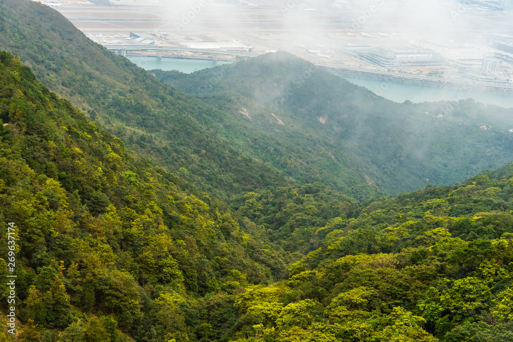 Fresh and green mountain with cloudy sky. Background for freshness and natural