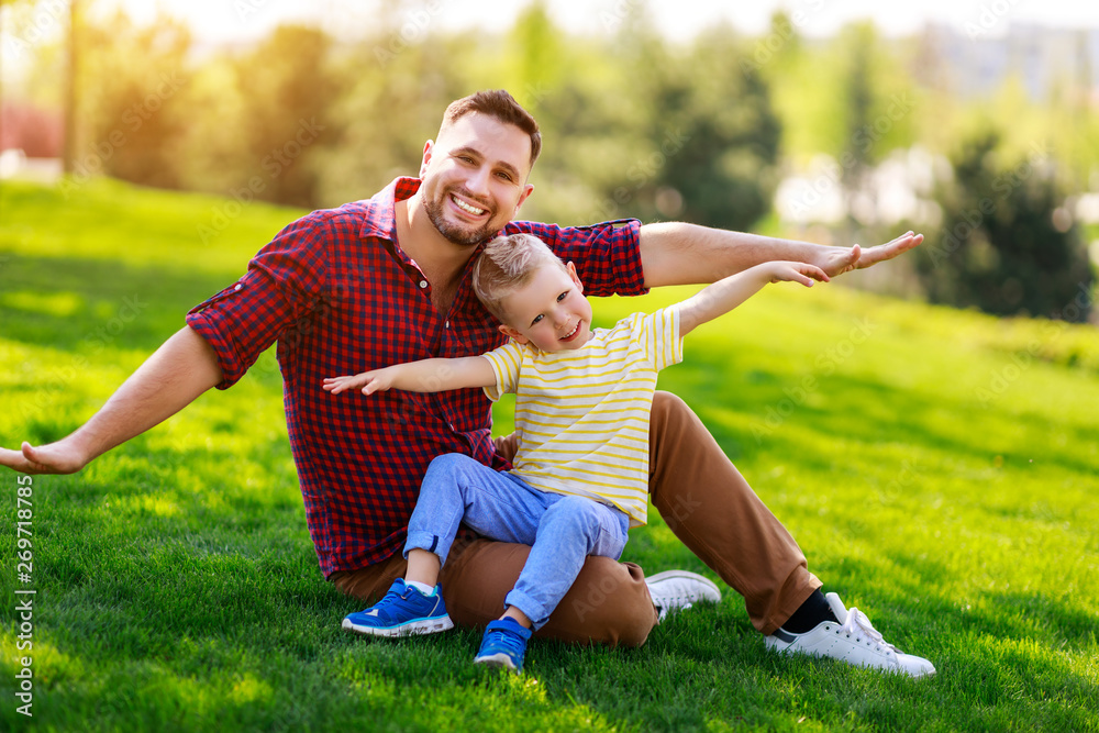 happy family father and child son in summer .