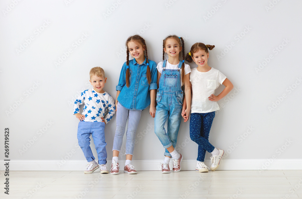 happy kids friends around empty walls.