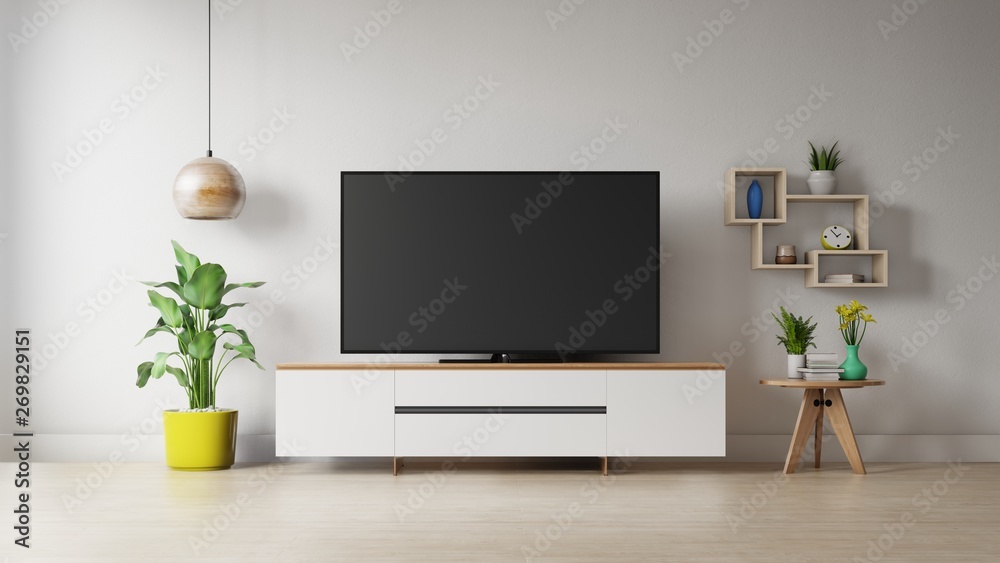 TV on the cabinet in modern living room with plant on white wall background,3d rendering