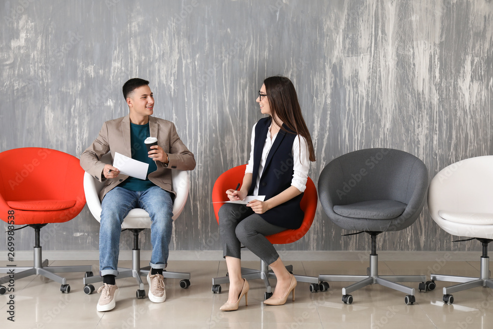 Young people waiting for job interview indoors