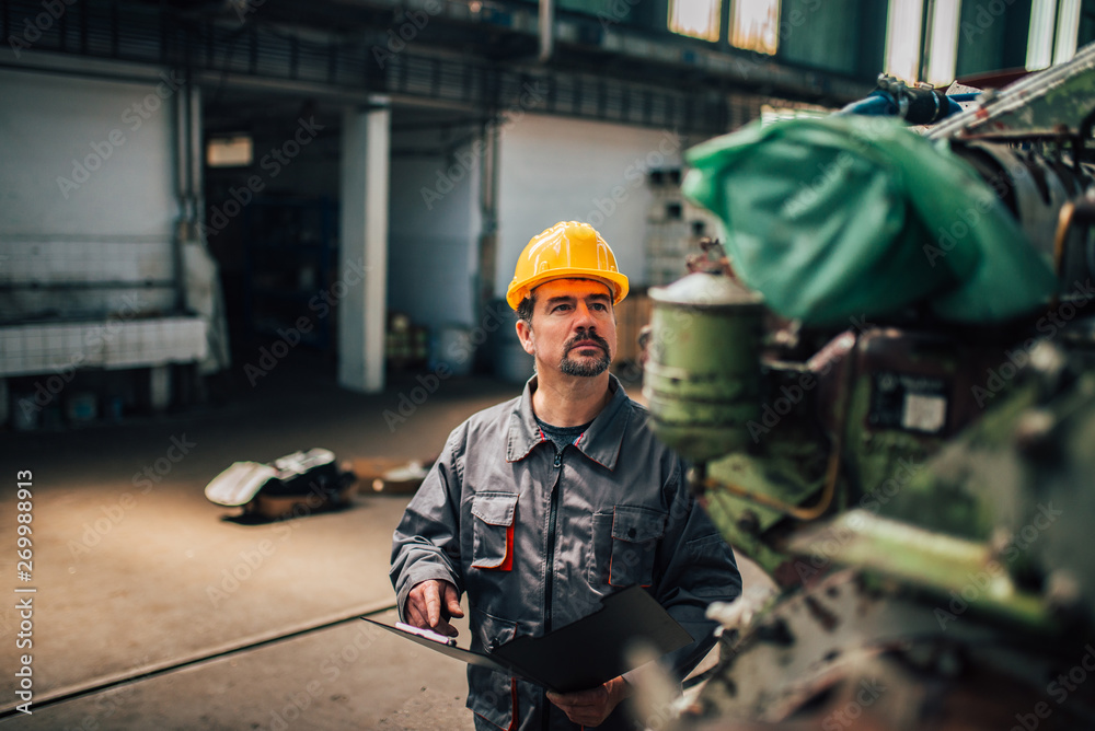 Inspecting parts in heavy industry manufacturing factory.