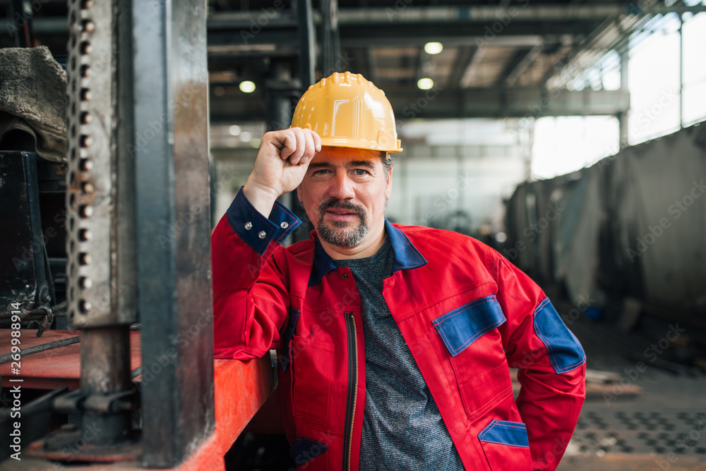 Portrait of a confident mature factory worker.