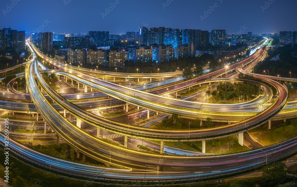 Large interchange with busy traffic aerial view at night in Chengdu, China