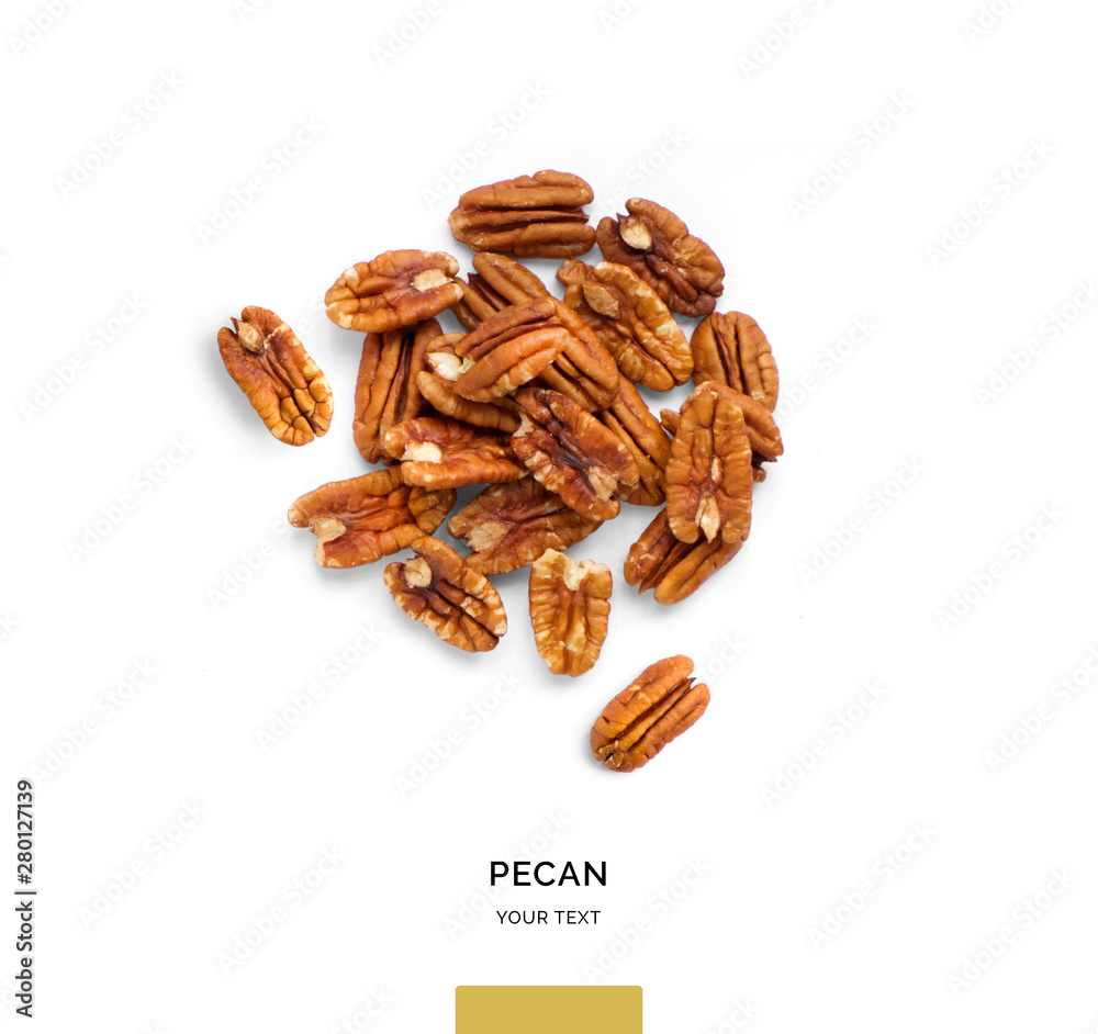 Creative layout made of pecan nuts on white background.Flat lay. Food concept.