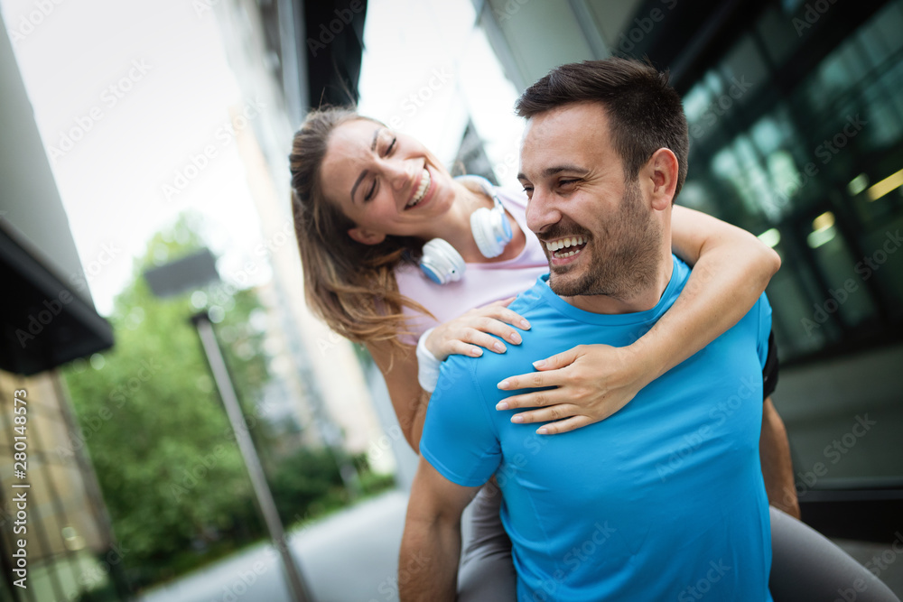 Sporty happy couple exercising together. Sport concept