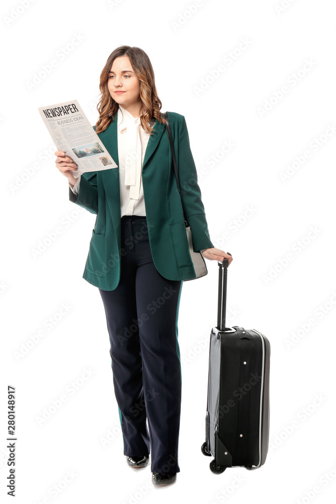 Young woman with luggage ready for business trip, on white background