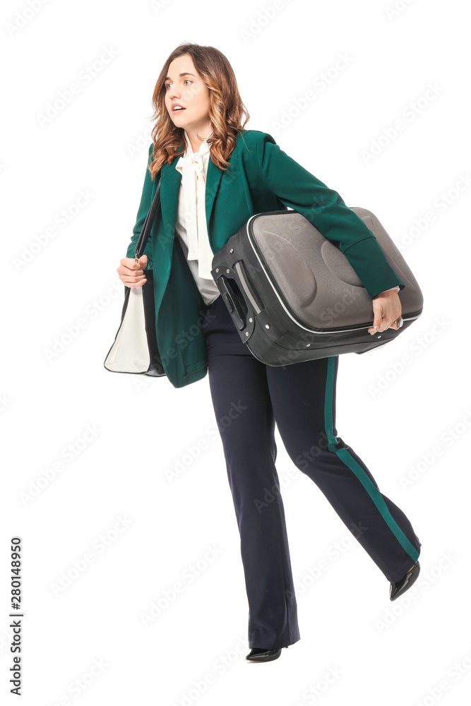 Young woman with luggage ready for business trip, on white background