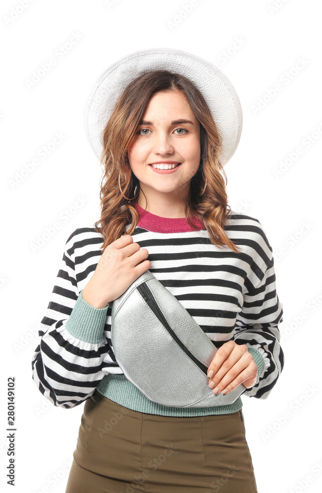 Young female tourist on white background