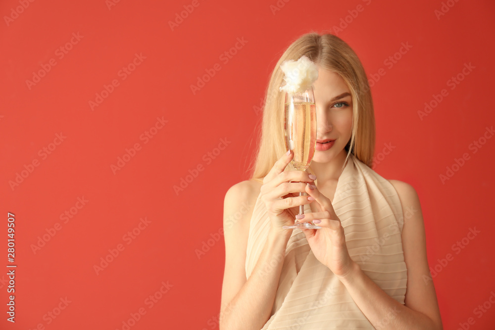 Beautiful woman with cotton candy cocktail on color background