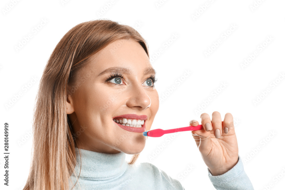 Woman cleaning teeth on white background