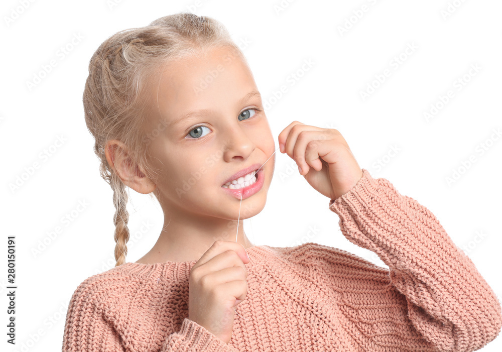 Little girl flossing teeth on white background