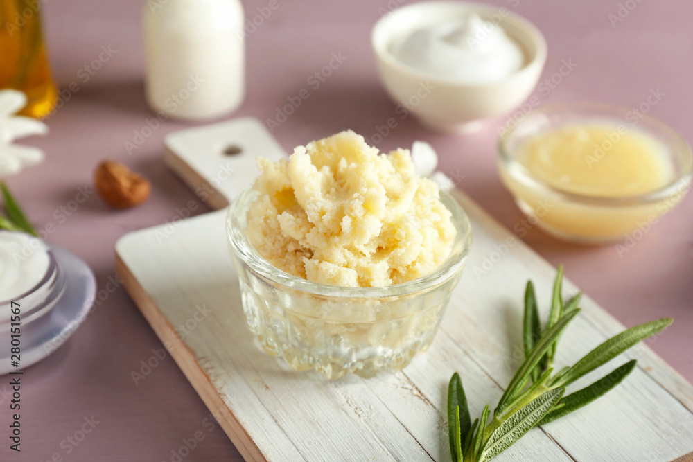 Bowl with shea butter on table