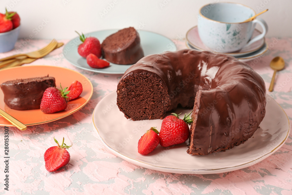 Plate with tasty chocolate cake on table