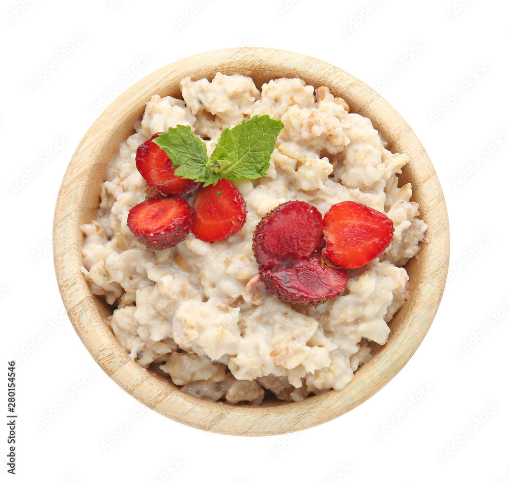 Bowl with tasty sweet oatmeal on white background