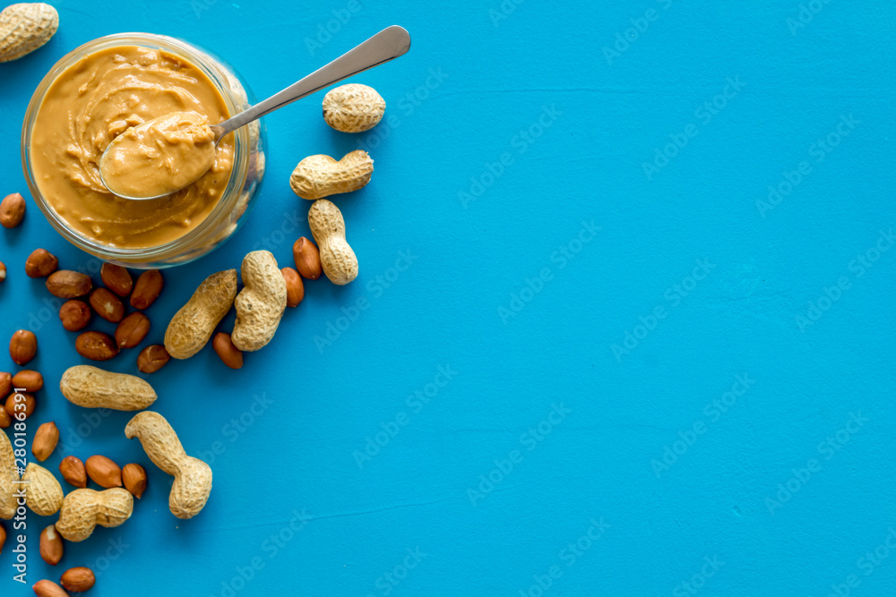 peanut butter for cooking breakfast at home on blue background top view mock up