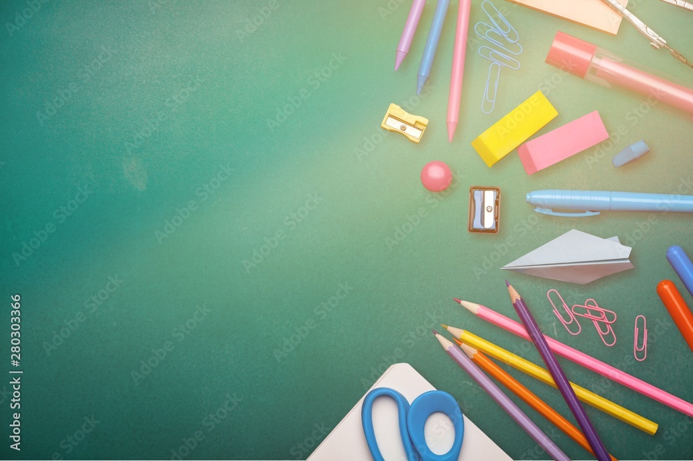 Assortment  of School supplies on  background