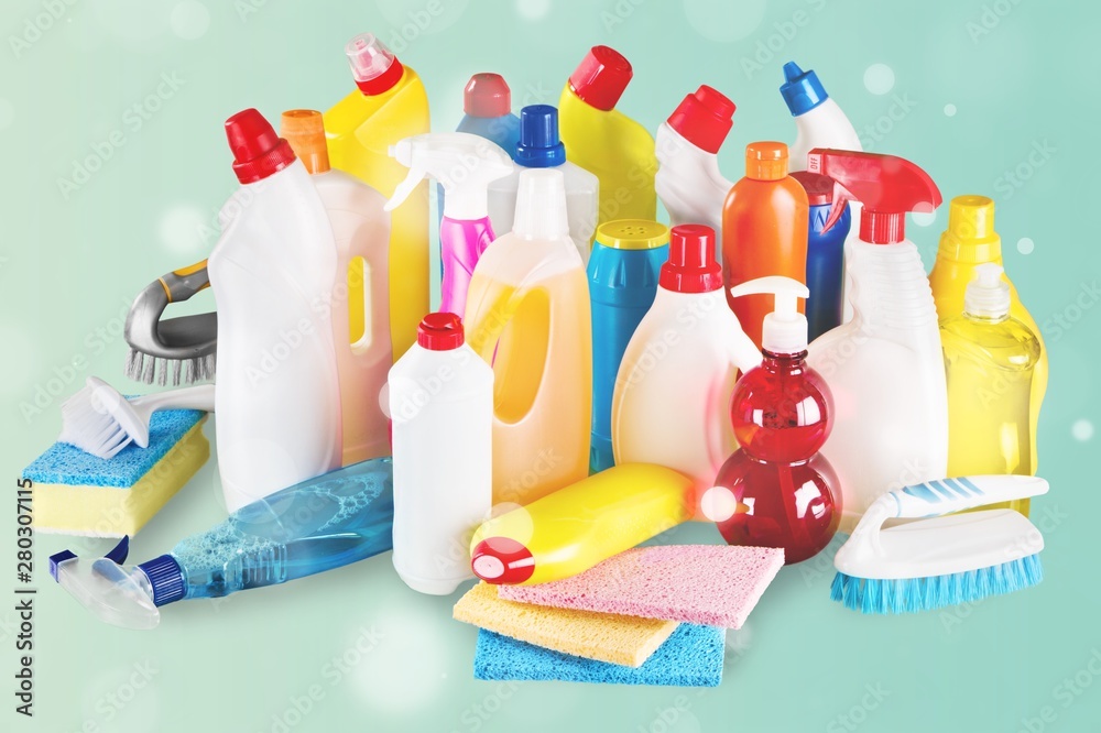 Plastic bottles, cleaning sponges on white background