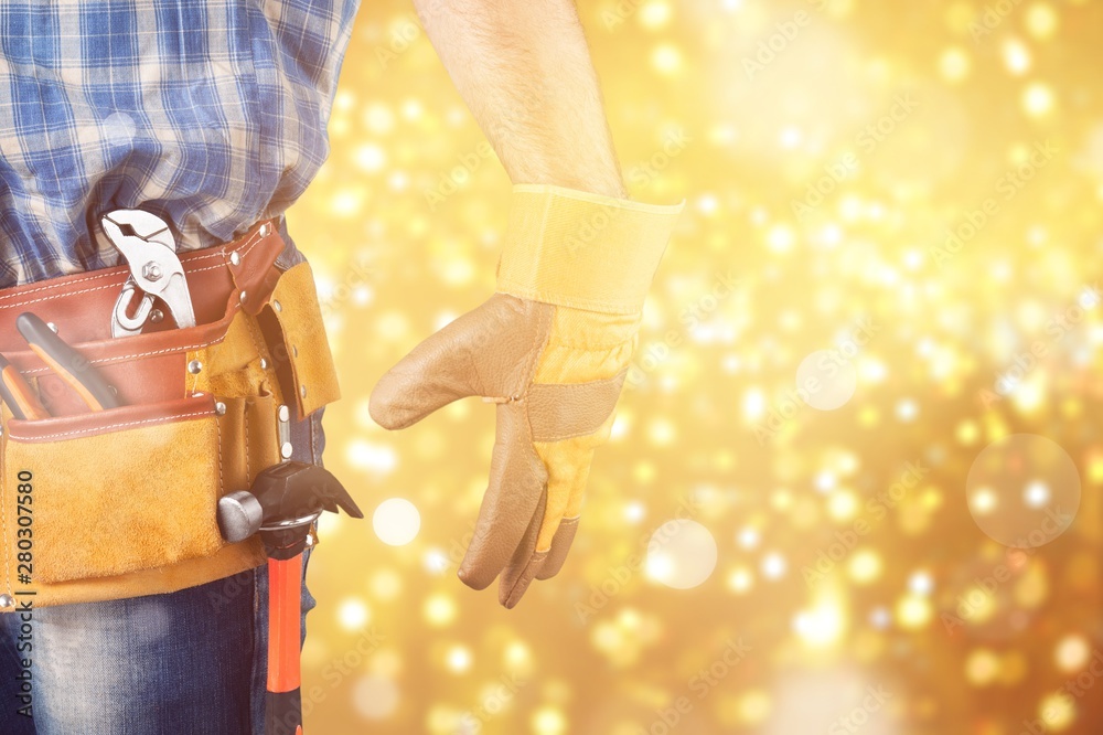 Worker with a tool belt. Isolated over white background.