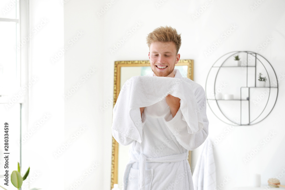 Morning of young man after shower at home